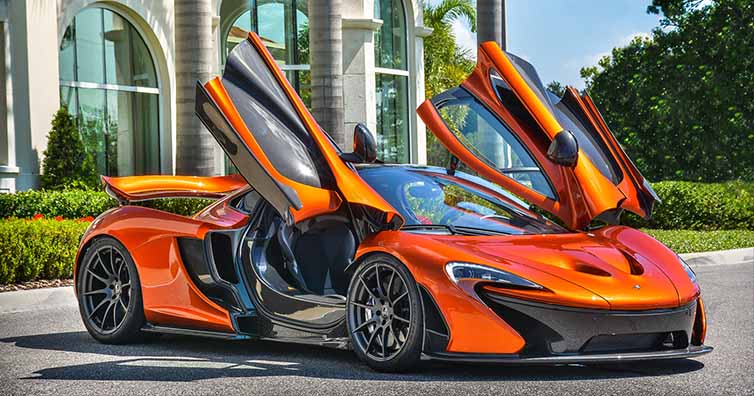 Mclaren Tampa Bay with sportscar parked in front